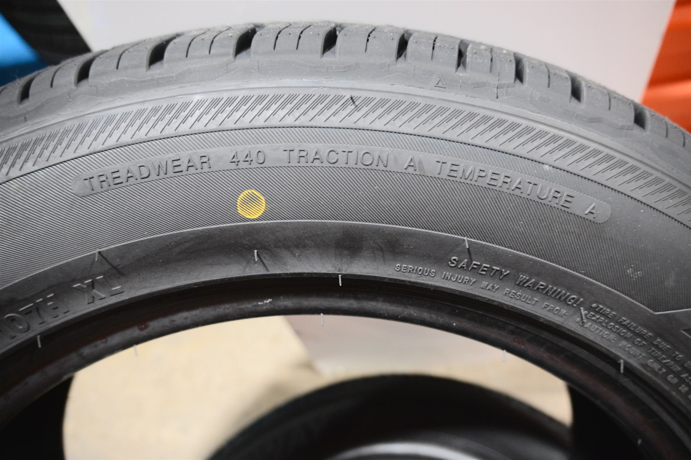 Actual tire sidewall showing treadwear, traction, and temperature markings